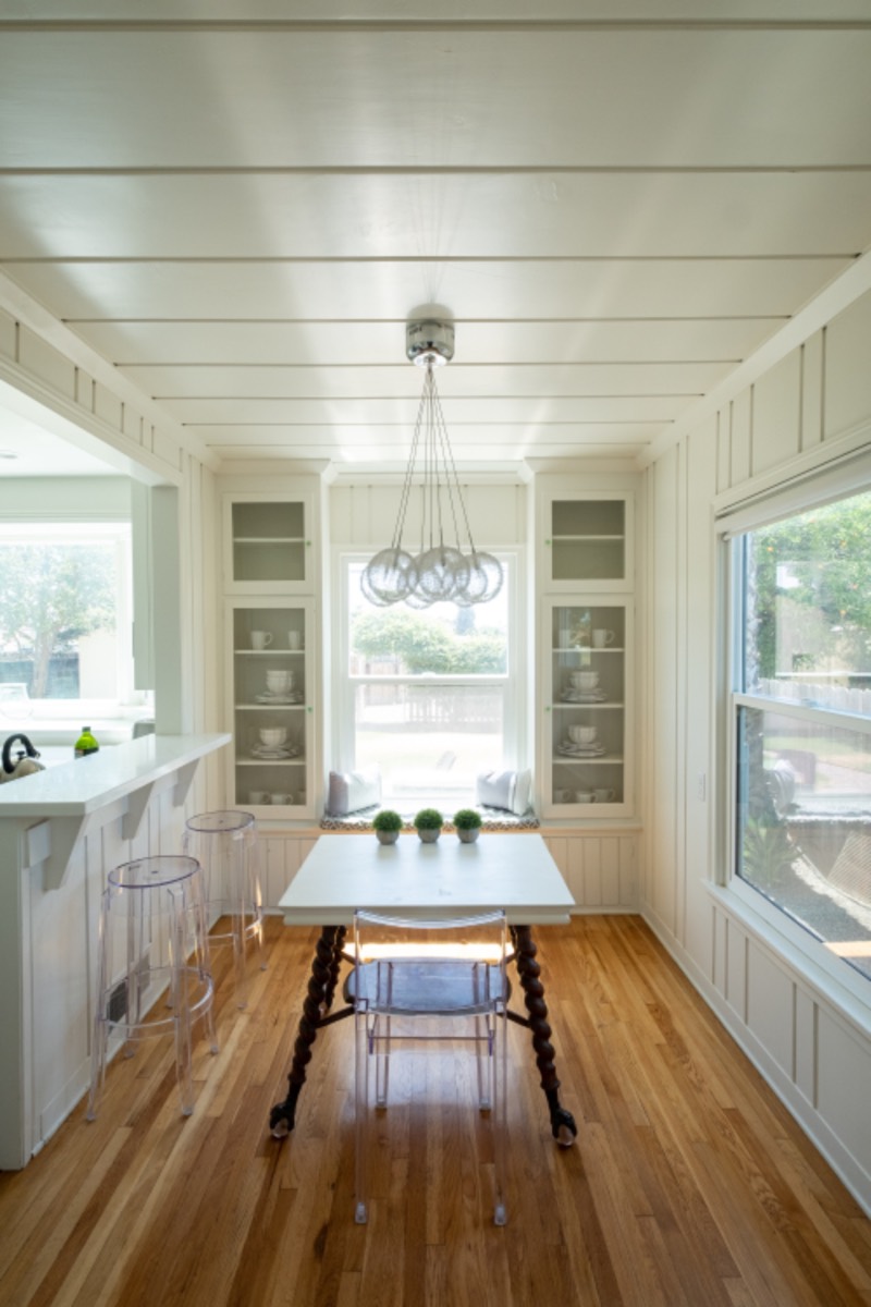 Renovated kitchen and dining nook with hardwood floors